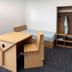 Complete Studio Package with Nesta cardboard table, chair and wardrobe in a room