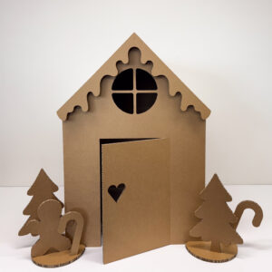 Gingerbread Cubby House made from honeycomb cardboard with door open and festive accessories